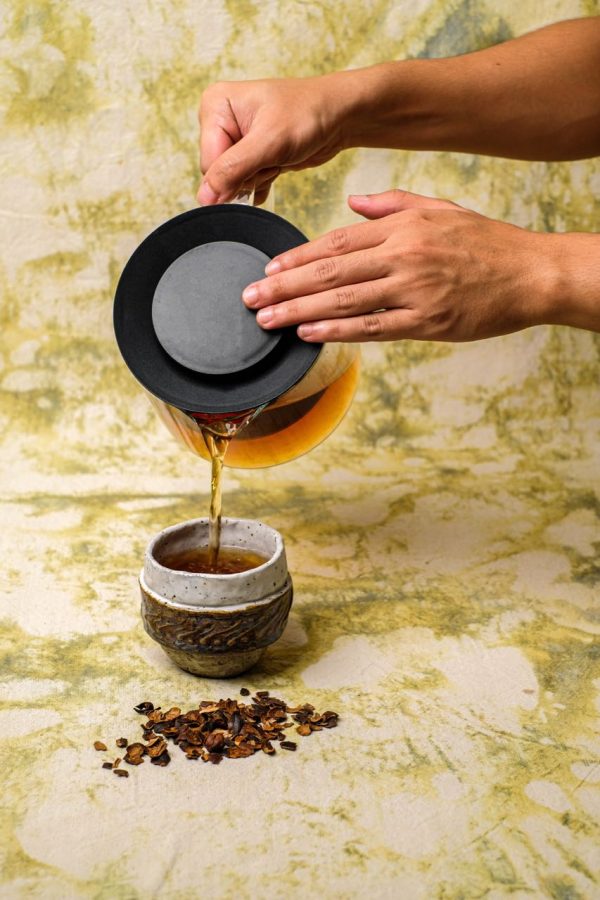 Dried Coffee Cherry tea brewing and pouring